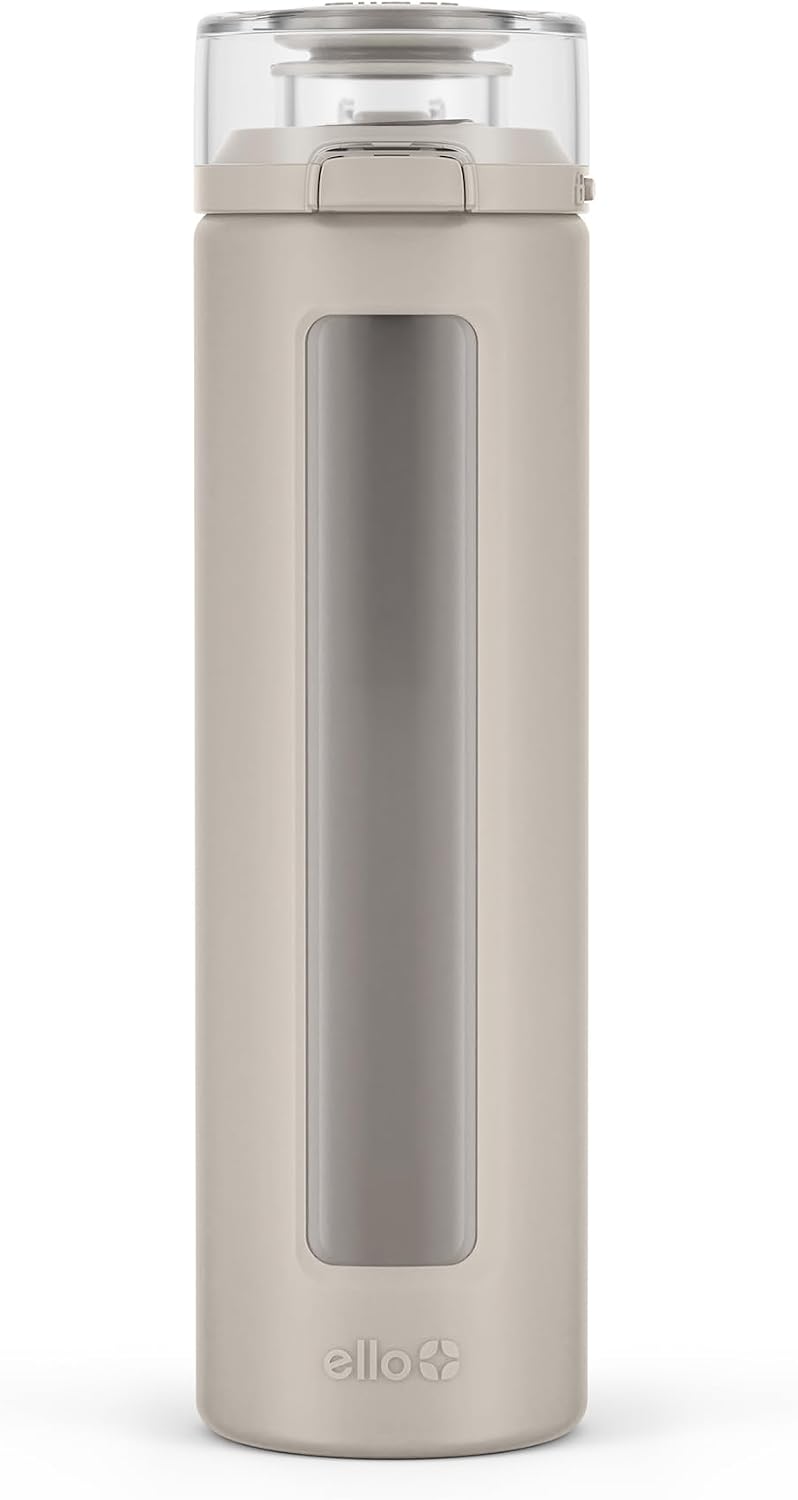 Ello Syndicate 20oz Glass Water Bottle with Flip Lid and Sleeve, Sand | Glass water bottle for iced drinks with leakproof flip lid, silicone sleeve, carry loop, BPA-free, and dishwasher safe